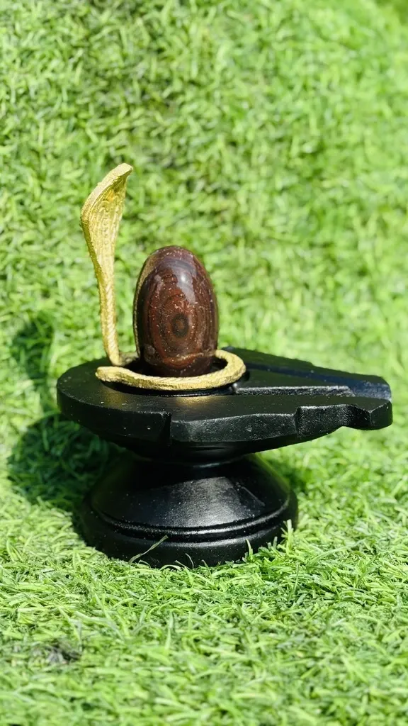 Original 2 Inch Mahamrityunjay Narmadeshwar Shivling with 4 Inch Damru Design Natural Stone Jaladhari |  Narmada Shiva Lingam